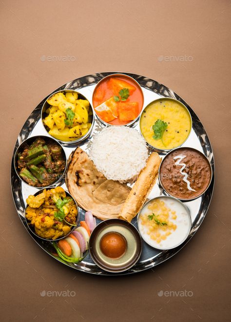 Dsc 2902-101 by stockimagefactory. Indian Hindu Veg Thali or food platter for lunch or dinner #Sponsored #stockimagefactory, #Indian, #Hindu, #Dsc Gujarati Thali, Veg Biryani, Punjabi Food, Indian Street Food, Delicious Vegetarian, Veg Recipes, Indian Dishes, Food Platters, Hearty Meals