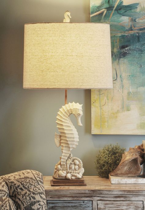 Complete your coastal oasis with this poly table lamp. The seahorse design is perfect if you want to add some fun to your abode, while the beige and ivory finish bring a sense of calm to the design. Catch the attention of your guests by placing this lamp in your entryway or guest room. StyleCraft Home Collection 31-in Beige with Ivory 3-Way Table Lamp with Fabric Shade | L34160BDS Beach Table, Coastal Living Rooms, Table Lamp Sets, Light Bulb Types, Beautiful Lamp, Coastal Style, Drum Shade, Beach House Decor, Coastal Living