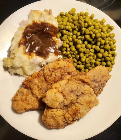 Chicken fried pork with mashed potatoes and gravy and English peas Fried Chicken And Mashed Potatoes, Chicken Fried Pork, Mashed Potatoes And Gravy, Potatoes And Gravy, Meals Dinner, English Peas, With Mashed Potatoes, Chicken Fried, Dinner Meals