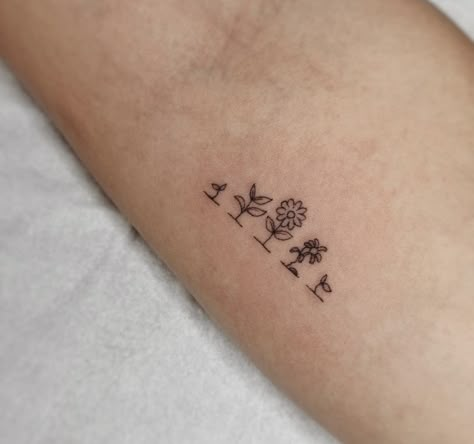 Tiny Garden Tattoo, Dainty Teacher Tattoos, Super Girly Tattoos, Educator Tattoos, Daycare Teacher Tattoo Ideas, Best Friend Plant Tattoos, Flowers Growing Tattoo, Growing Flower Tattoo, Small Tattoos Flash