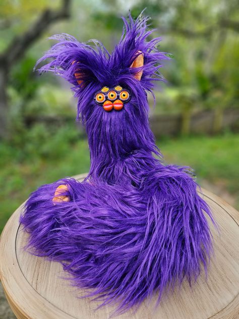 PLEASE READ! Custom 3 foot Long Furby! I can make your furby look however you'd like. I hand paint the faceplates and eyes so they can be whatever you can imagine. Glitter? Glow in the dark? Poop brown? Metallic? You name it, I can do it. The furs are limited to what I have in stock, but if there is a specific color you'd like you can message me and I can most likely make it happen. Feel free to reach out with any questions you have! Same with the secondary color! I have the 2 eyed and 3 eyed faceplates. Orders will take between 1-2 weeks to complete. Primary color is fur color (body and backs of ears). Secondary color is for inner ears and feet. Please message me with any special requests (two-tone, antennae, bows, stuff like that). These long bois come with a wire so they're fully posabl Long Furby, Hand Paint, I Can Do It, You Name It, Name It, Primary Color, In The Dark, Glow In The Dark, Pet Toys