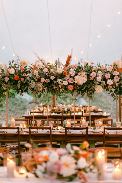 Rattan and weddings are a match made in heaven. Truth! This boho chic wedding with a forest ceremony and decked up tented reception is the living proof. With rattan pendants and chargers, blue toile napkins and a beer stein escort card display, this couple went all in for a laidback fall wedding that reflected their style and story to a T! See it now on Ruffled Blog #weddingbackdrops #bridalkaftan #tallcenterpieces Fall Wedding Greenery Decor, Boho Chargers Wedding, Wood Tables Wedding Reception, Boho Tent Wedding Reception, Boho Chic Wedding Table Decor, Fall Wedding Tent Decorations, Fall Tent Wedding Reception, Tent Fall Wedding, 2024 Fall Wedding Colors