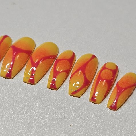 Set your nails ablaze with this stunning "Sunset Flame" press-on nail set. Featuring a bold blend of vibrant yellow and orange, each nail is uniquely adorned with a fiery pink abstract design that resembles glowing lava flows. These nails evoke the warmth and intensity of a summer sunset, perfect for making a statement. Hand-painted with precision and care, this set is perfect for any occasion--from casual outings to special events. Whether you're looking to spice up your everyday look or complete a standout ensemble, these press-ons are sure to turn heads. -Set includes 10 reusable nails -Available in various sizes for a custom fit -Long-lasting and durable Let your nails shine with the "Sunset Flame" set, and bring the heat to your style! Orange Sunset Nails, Orange Nails Design, Lava Nails, Sunrise Nails, Sunset Nails, Orange Nail Designs, Stunning Sunset, Y2k Nails, Lava Flow