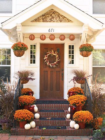 Curb Appeal: Lush potted mums add color to this front stoop, as do paper lanterns hung from the portico. White pumpkins add contrast and a harvest wreath defines the solid wood door. Fall Landscaping, Fall Front Porch Ideas, Front Stoop, Small Ideas, Entry Decor, Small Wreaths, Autumn Decorating, Fall Front Porch, Fall Decorations Porch