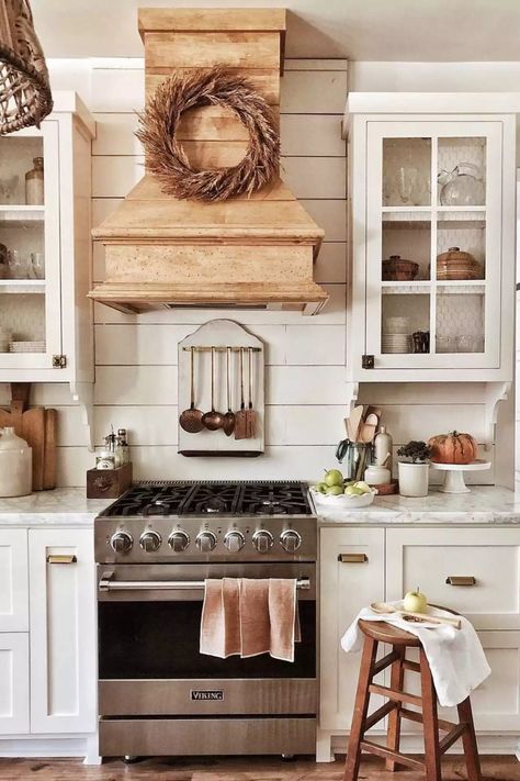 This rustic kitchen looks charming with a chicken wire detail on the cabinet door frames instead of the usual glass ones. The whole thing screams farmhouse. #FarmhouseKitchen #CottageKitchen #KitchenIdeas #TheSpruce Grey Shutters, Farmhouse Kitchen Cabinet, Wyoming House, Kitchen Cabinet Paint, Kitchen Favorites, Cottage Kitchen Design, Deco Champetre, Rustic Kitchen Cabinets, Cabinet Paint