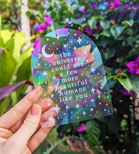 "\"The universe could use a few more beautiful humans like you\" This sweet celestial suncatcher window decal makes a really beautiful gift for friends & loved ones. Suncatcher Decal Size: 4\" x 5\", Printed in White on rainbow suncatcher prismatic film Directions: apply your new sun catcher decal to a window with * direct * sunlight (this is really important!) & watch vibrant rainbows bathe your space! ⋒ Created & shipped from our art studio in Kaneohe, Hawaii.🌈 Stickers are designed, manufact Suncatcher Sticker, Rainbow Magic, Rainbow Maker, Rainbow Stickers, Moon Stars, Window Decals, Stars And Moon, Cricut Projects, Suncatchers