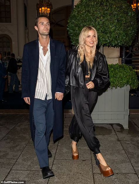 Sienna Miller, 42, looks stunning in a cropped leather jacket and silk trousers as she enjoys a date night with boyfriend Oli Green, 27, in Paris - eight months after welcoming their baby daughter | Daily Mail Online Sienna Miller Leather Jacket, Sienna Miller Aesthetic, Sienna Miller Street Style 2024, Date Night With Boyfriend, Night With Boyfriend, Plain Black Crop Top, Sienna Miller Hair, Sienna Miller Style, Baby Daughter