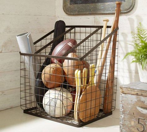 Sports equipment org- love the basket. Could store in the closet Sports Equipment Organization, Sports Equipment Storage, Sports Storage, Sports Items, Equipment Storage, Wire Storage, Entryway Organization, Tote Storage, Utila