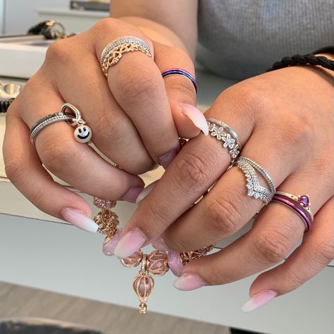 Remix your ring stacks! Our Pandora rings are ready to be styled into different metal and color combinations to suit your mood. 💍💗✨ Don't forget to add a ring connector and mini dangle to our new Pandora Me Rings for a fun and whimsical addition to your wardrobe! #PandoraLasVegas #PandoraMe #ForEveryMe #PandoraRings #RingStacks #StackItUp #PandoraStyle #HappyFace #PopofColor #MixedMetals #PandoraJewelry #NailAccessories #GetCreative #Style Photo Credit - @venice.dowling Rings Aesthetic Pandora, Pandora Rings On Hand Aesthetic, Pandora Stacking Rings Ideas, Pandora Ring Stack Ideas, Ring Stacking Ideas Mixed Metals, Ring Combinations Aesthetic, Pandora Ring Stack, Pandora Stackable Rings Ideas, Pandora Rings Stacked Ideas