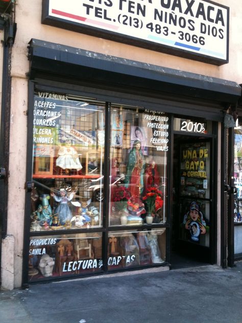 Botanicas are shops selling herbs, charms, potions, and rituals associated with Santeria (Cuban voodoo). This shop is located near MacArthur Park in L.A. Selling Herbs, Metaphysical Store, Spiritual Bath, Homemade Oil, African Spirituality, Black Halloween Dress, Best Mysteries, Working Late, Halloween Dress