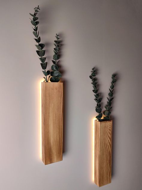 PRICES MAY VARY. BEAUTIFUL LED WALL PLANTER DECORATION – These slim wood wall planters with LED lights and 4 faux eucalyptus stems , and a perfect complement for any wall in your home or office. It will add personality to your gallery wall, bedroom, over the bed, living room, dining room, kitchen, bathroom, indoor patio, bedroom, entry way, dorm or office EASY TO HANGING – This is a 4 sided wooden wall vase . Comes with all necessary hardware, hanging sawtooth attached on the back, making these Farmhouse Wall Kitchen Decor, Bathroom Wall Shelves Wood, Place Mat Wall Decor, Natural Wood Office Decor, Decor For Small Bathroom, Wall Niche Decorating, Plant Wall Decor Ideas, Wall Succulents, Vines For Room