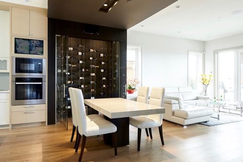 Not all wine cellars need to be expensive. This modern Vancouver home’s wine racks system, with floating bottles, **TAKES YOUR BREATH AWAY** without costing a fortune. Using a unique cable racking system . . . Wine Display Wall, Replacement Shelves, Glass Shelving Unit, Wine Cellar Racks, Modern Wine Rack, Glass Wine Cellar, Custom Wine Cellars, Metal Wine Rack, Display Wall