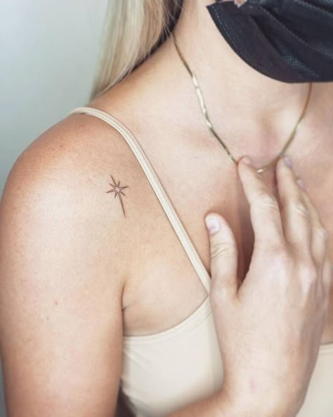 Minimalist north star tattoo on the shoulder. Dainty North Star Tattoo, North Star Tattoo Shoulder, Arrow And Star Tattoo, North Star Tattoo Sternum, Fine Line North Star Tattoo, Star Tattoo Ribcage, North Arrow Tattoo, Star On Shoulder Tattoo, Bethlehem Star Tattoo