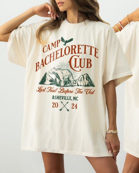 ✺ CAMP BACHELORETTE CUSTOM SHIRTS ✺ PLEASE NOTE: The design has a distressed effect, it's meant to look worn out/scratched ! Colours may appear different on different digital screens and may not be a true representation of the actual colours. * Q U I C K F A C T S * This design is a unique, one-of-a-kind awesome illustration that has been created in house. ✺ 100% Cotton (fiber content may vary for different colors) ✺ Classic fit ✺ Sizing is unisex so runs like men's, though not overly large ✺ Most women find their typical size works best, since they are meant to fit a touch loose This is a Unisex T-Shirt which you can use as an Oversize T-Shirt Dress, please check the dimensions to make sure you are happy with the size ! *YOUTH BELLA CANVAS TEES * ✺ 100% Airlume combed and ring-spun cotton Camp Bachelorette Shirts, Summer Camp Bachelorette, Camping Bachelorette Party, Camp Hoodie, Lake Bachelorette, Camp Bachelorette Party, Camp Bach, Camp Theme, Themed Bachelorette