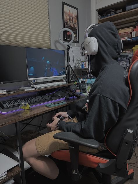 boy in hoodie playing video games