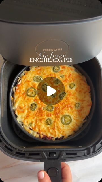 Hayley Dean on Instagram: "Air fryer chilli enchilada pie 🥧 WOW this is amazingggg 😍 so start by spraying oil in a tin, add a tortilla, some warmed up chilli, a sprinkle of cheese, repeat until you’ve used up 4 wraps, last wrap with just cheese and jalapeños on top, air fry on 160 for about 15 minutes or until bubbling and golden, delish with a dollop of sour cream! For loads more air fryer recipes check out my books! Both available on Amazon and the link is in my bio ❤️😍" Air Fryer Tortilla Wraps, Enchilada Pie, Fried Jalapenos, Fryer Machine, Tortilla Wraps, Air Fry, My Books, April 13, Edible Art