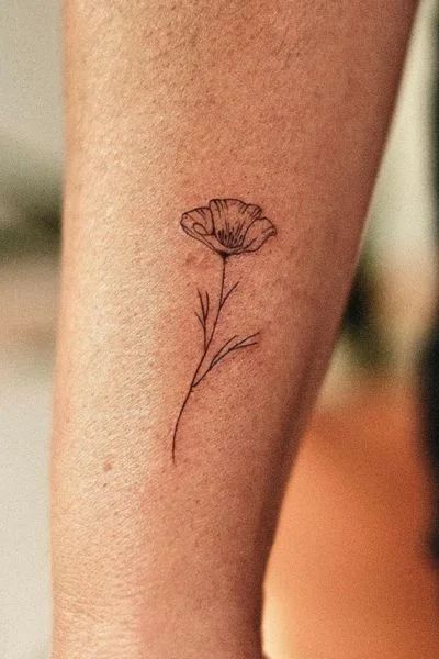 Exploring the World of Poppy Flower Tattoos - Tweakbee Poppy Arm Tattoos For Women, Poppy Name Tattoo, Poppie Tattoos, Matilija Poppy Tattoo, Yellow Poppy Tattoo, Poppy Tattoos For Women, Ca Poppy Tattoo, White Poppy Tattoo, Golden Poppy Tattoo