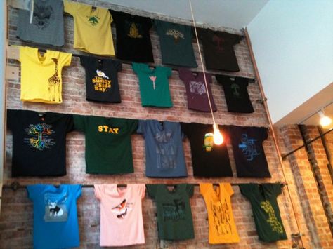 T-shirts displayed in the new Oaklandish store. Store Displays Ideas, T-shirt Display, Tshirt Display, Shirt Display, Clothing Displays, Retail Merchandising, Store Fixtures, Merchandising Displays, Tap Room