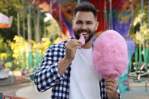 Happy young man eating cotton candy at funfair Eating Cotton Candy, Business Interior Design, Business Interior, Man Eating, Taking Selfie, Food Drinks, Royalty Free Pictures, Cotton Candy, Candy