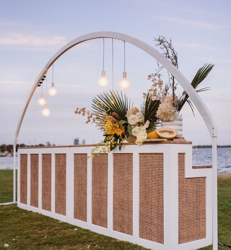 HEART STRINGS | HIRE + STYLE on Instagram: “Over at the Bar feat our curved ‘rainbow’ arbor over our new white & rattan bars with @festoonlightingperth @rose.and.bud…” Hire Style, Bar Wedding Reception, Tuscan Inspired Wedding, White Rattan, Pool Party Decorations, Event Props, Blue Bar, Tuscan Inspired, Tropical Pool