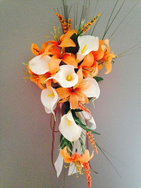 Cream Ivory calla lily with orange small tiger lily cascade bouquet Tiger Lily Bouquet, Lily Plant Care, Teal Wedding Colors, Wedding Cake Fresh Flowers, Fall Wedding Hairstyles, Calla Lily Bouquet, Lily Bouquet, Cascade Bouquet, Fall Wedding Bouquets