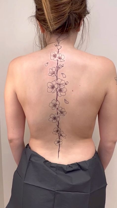 Women Flower Back Tattoos, Cherry Blossom Tree Spine Tattoo, Tree On Spine Tattoo, Japanese Cherry Blossom Spine Tattoo, Cherry Blossom Tattoo On Back Spine, Spine Tattoo Cherry Blossom, Anime Spine Tattoo, Blossom Spine Tattoo, Cherry Blossom Spine Tattoo