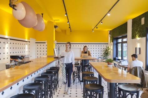 Wall Of Plants, Yellow Restaurant, Resturant Design, Black Restaurant, Small Restaurant Design, Themed Cafes, Small Restaurant, Yellow Interior, Bar Design Restaurant