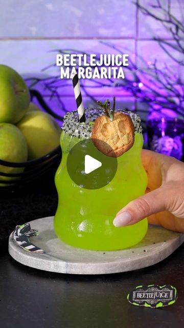 Thirsty Bartenders on Instagram: "Say BEETLEJUICE for the shrunken apple head garnish recipe! 🪲

I am so excited for the new Beetlejuice movie! I highly recommend saving this recipe and watching the original at home with one of these Beetlejuice margaritas in hand. It’s the perfect addition to a spooky movie night or Halloween party!

Beetlejuice Margarita:
🪲 2 oz tequila
🪲 1 oz lime juice
🪲 1 oz simple syrup
🪲 ½ oz apple pucker
🪲 ½ oz melon liqueur
🪲 shrunken apple head garnish
🪲 torched rosemary sprig
🪲 black and white salt

#cocktails #halloweendrink #halloweencocktail #beetlejuice #beetlejuice2 #tequila #tequilacocktail #tequilarecipe" Beetlejuice Margarita, Spooky Movie Night, Apple Pucker, Creepy Halloween Party, Tequila Recipe, Halloween Party Planning, Melon Liqueur, Beetlejuice Movie, Beetlejuice Halloween