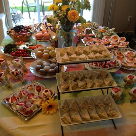 Cucumber tea sandwiches, individual strawberry shortcakes, macaroons, fruit salad, bagels with flavored cream cheese, and cookies like pepperidge farms Milanos or chessmen dipped in chocolate   All on platters or trays on white table cloth Individual Strawberry Shortcake, Flavored Cream Cheese, Cucumber Tea, Cucumber Tea Sandwiches, Hp Sauce, Strawberry Shortcakes, Dipped In Chocolate, High Tea Party, Tea Party Food