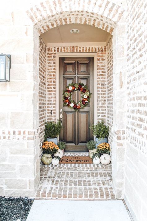 Autumn colors in this fall front porch. mums, pumpkins, hey there pumpkin door matt mixed with burnt orange, muted greens and touches of golden yellow. #ABlissfulNest #fallporch #falldecor #fallinspiration Small Brick Front Porch Ideas, Porch Mums, Wreath Decorating Ideas, Porch Wreath, Fall Entryway, Fall Decor Inspiration, Living Vintage, Pumpkin Door, Fall Front Porch Decor