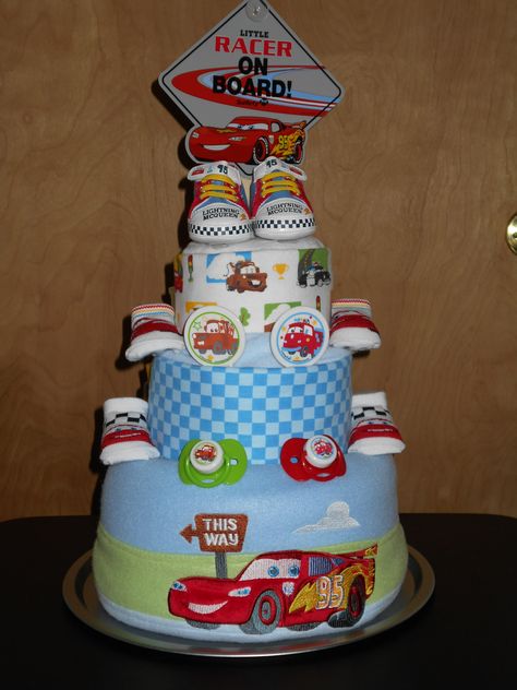 Disney/Pixar Cars Theme Diaper Cake  just4udiapercakes@yahoo.com Cars Baby Shower Theme, Disney Diaper Cake, Baby Shower Cupcakes Neutral, Baby Shower Food Easy, Pastel Rainbow Cake, Cupcake Videos, Baby Shower Decorations Neutral, Disney Cars Birthday, Diaper Cake Boy