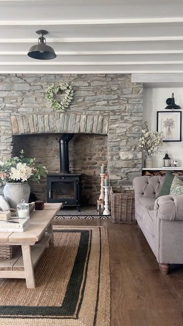 Dominique | Cwmrhys Cottage on Instagram: "Sunshine filled summer evenings ☀️✨ #livingroom #livingroomdecor #livingroomstyle #livingroomdesign #stonewall #featurewall #featurefireplace #interiordecor #interiordecorating #coffeetable #coffeetablestyling #roomstyle #roomstyling #shelfstyling #shelfie #comfycottagecharm #cosyhomestyle #cosycottage #cosyhome #cottageinterior #moderncountrystyle #moderncountryinteriors #countryhome #countryhomestyle #sittingroomdecor #loungedecor #homerenovation #h Cosy Living, Cottage Living Rooms, Cottage Interior, Cosy Living Room, Cottage Interiors, Cottage Living, Living Room With Fireplace, Fireplace Design, Stone Fireplace