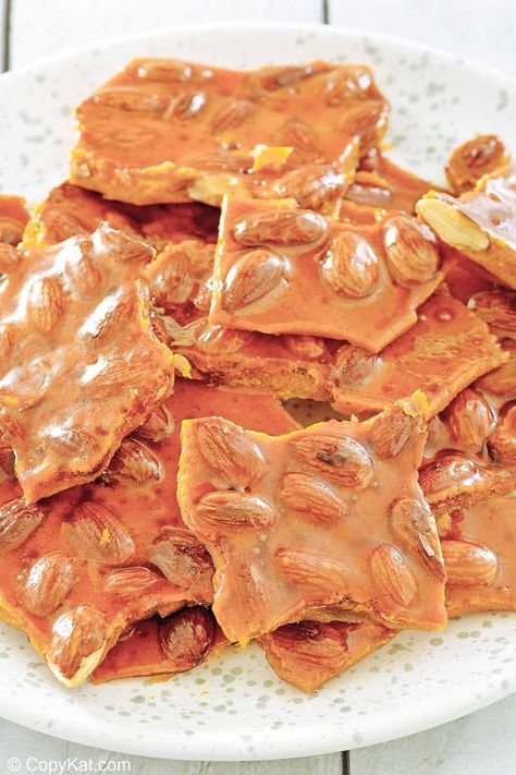 Almond brittle is delicious and crispy candy enjoyed for generations. Get the easy recipe and learn how to make the best brittle with almonds. Find out a simple ingredient swap to make almond brittle with no corn syrup. A great candy to make for the holidays and homemade gifts. #almondbrittle #easycandyrecipe #christmascandy Cherry Mash Candy Recipe, Holiday Entertaining Food, Almond Brittle, Easy Candy Recipes, Brittle Recipes, Candied Almonds, Candy Truffles, Copykat Recipes, Beef Casserole Recipes