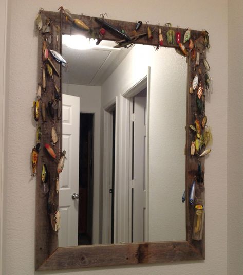 DIY fishing lure mirror for lakehouse. My mom made this. Super cute & super easy! :) The options are endless for whatever theme you have going on Hunting And Fishing Themed Bedroom, Fishing Bathroom Mirror, Decorating With Fishing Poles, Fishing Theme Bathroom, Fishing Cabin Bedroom, Hunting And Fishing Decor, Fishing Theme Room, Fishing Home Decor, Fishing Bathroom Ideas