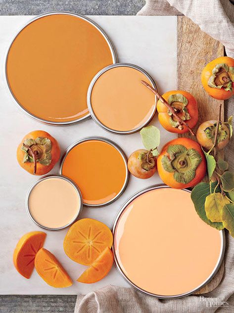 These fall-inspired oranges can look great any time of year. How do you build a palette around these spicy shades? "To create a larger color story, use multiple tones of persimmon rather than one specific shade. Mixing deeper and lighter shades tones down the individual shades and makes it easier for the eye to understand the palette as a whole,"  designer Emily Henderson says. Coral Paint Colors, Orange Paint Colors, Persimmon Color, Pink Paint Colors, Shingle Colors, Trending Paint Colors, Paint Color Palettes, Kitchen Paint Colors, Orange Paint