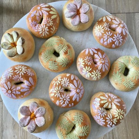 The bagel lineup for today! The stenciled bagels from the other day turned out so beautiful, I had to do them again. I added some greenery… | Instagram Flower Scoring Bread, Floral Sourdough Scoring, Bread With Flower Design, Sourdough Bread Paint, Painted Sourdough Loaf, Painted Bread, Starter Recipe, Bread Art, Sourdough Starter Recipe