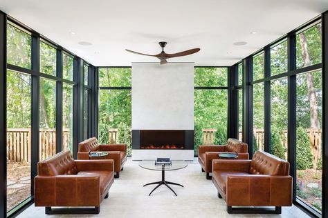 The owners of this classic Tudor home nestled in Minneapolis’ Cedar Lake area adored their abode, but they didn’t love its lack of connection to the outdoors. Quartersawn Design Build’s solution? Build a glass box getaway. To learn how to recreate this sunny space, follow the link. 📸 Andrea Rugg Modern Sunroom, Sunroom Inspiration, Midwest Home, Modern Tudor, Tudor Home, Sunroom Designs, Interior Windows, Black Windows, Glass Box