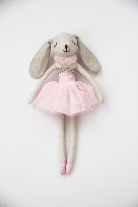 Little Miss Rose Bunny has very long silver sparkle ears so that she can listen to every word you say. She loves story books and fairytales and she loves to drink pink lemonade. Rose Bunny is made lovingly from linen with sparkle silver ears and a satin and tulle dress. A faux fur collar keeps her Ballerina Animals, Rose Sister, Tutu En Tulle, Flopsy Bunny, Baby Toys Newborn, Rosé Sister, Heirloom Toys, Bunny Soft Toy, Handmade Soft Toys