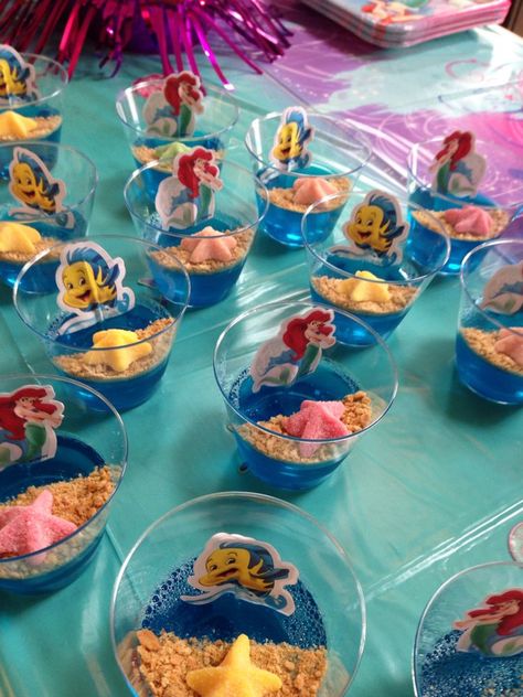 Ariel Food Ideas, Mermaid Birthday Party At The Park, Ariel Food Ideas Under The Sea, Little Mermaid Party Food, Ariel Themed Birthday Party Party Snobs, Princess Ariel Table Centerpiece, Mermaid Birthday Souvenir Ideas, Pool Party Ideas For Kids, Little Mermaid Centerpieces