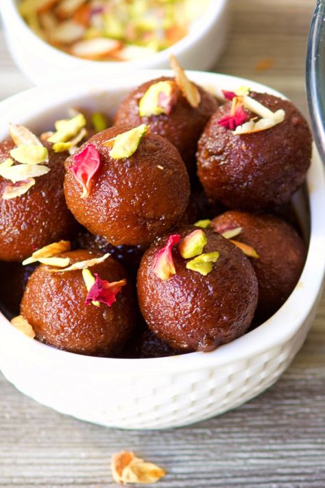 Gulab jamun is a milk-solid-based sweet from the Indian subcontinent, and a type of sweet, popular in India, Nepal, Pakistan, the Maldives, and Bangladesh, as well as Myanmar. I have added a vegan twist and its so easy to make. These Vegan Gulab Jamuns are quick and easy to prepare using semolinaand taste very close to the real milk based Gulab Jamuns. 


Gulab Jamuns are an easy Vegan Indian Dessert when prepared using this recipe. Vegan Indian Dessert, Royal Recipe, Jamun Recipe, Vegan Indian Recipes, Gulab Jamun, Indian Dessert Recipes, Indian Desserts, Indian Sweets, Healthy Sweets Recipes