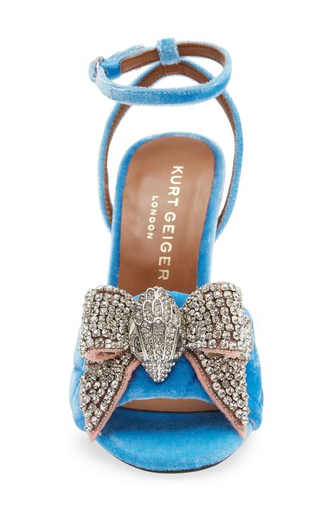 A crystal-dusted bow makes a glamorous statement at the toe of this scene-stealing sandal secured by a slim strap at the ankle. 4" heel Adjustable ankle strap with buckle closure Textile upper/synthetic lining and sole Imported Gold Stiletto Heels, Sandals For Ladies, Metallic High Heels, Strap High Heels, Kurt Geiger Heels, Kensington London, Strappy Stilettos, Ankle Strap High Heels, London Shoes