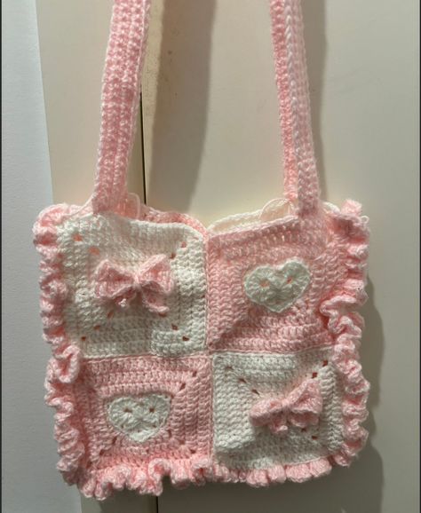 Crochet tote bag with heart and ribbon granny squares and a ruffle border. Colour may vary from photo. 2 Colour Granny Square, Crochet Bag With Granny Squares, Coquette Granny Square, Crochet Cute Granny Square, Preppy Crochet Ideas, Crochet Ruffle Pattern, Crochet Ruffle Bag, Crochet Tote Bag Ideas, Clothes To Crochet