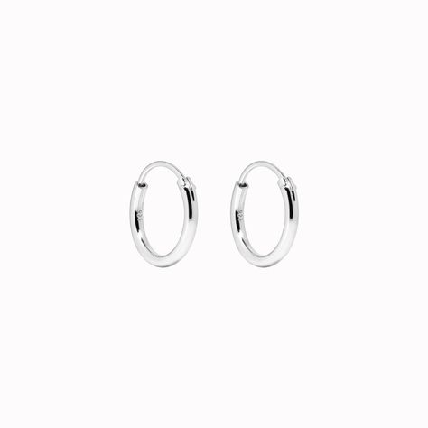 Handcrafted in sterling silver, these classic hoop earrings measure at 12mm Simple Silver Earrings, Small Silver Hoop Earrings, Trendy Rings, Dainty Hoop Earrings, Rings Jewelry Fashion, Sustainable Jewelry, Traditional Jewelry, Sterling Silver Hoops, Jewelry Inspo