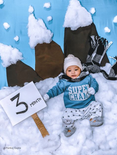 In this pic, we use brown colour cloth for mountain and blue colour cloth as a background. After that, we have used cotton for ground & top of the mountain. If you are looking for more interesting ideas then visit my profile. Winter Baby Monthly Photoshoot, Winter Season Photography, Winter Baby Shoot Ideas, Winter Photoshoot Ideas For Baby, Baby Winter Photoshoot Ideas, 5 Month Baby Photoshoot Ideas, 4th Month Baby Photoshoot Ideas, Baby Winter Photoshoot, Winter Theme Photoshoot