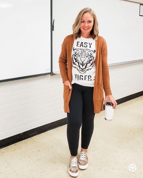 Casual everyday comfy remote teacher work at home outfit featuring a tiger tee, tan cardigan, Lululemon leggings, and leopard sneakers #casualstyle #teacher #comfy #workathome #cardigan #tiger #fall http://liketk.it/2VDu4 @liketoknow.it #liketkit Teacher Yoga Pants Outfit, Casual Substitute Outfits, Comfy Cute Teacher Outfits, Comfy Fall Outfits For Teachers, Teacher Outfit With Leggings, Outfits With Tan Cardigan, Leggings And Cardigan Outfit Casual, Cardigan And Leggings Outfit Fall, Fall Preschool Teacher Outfits