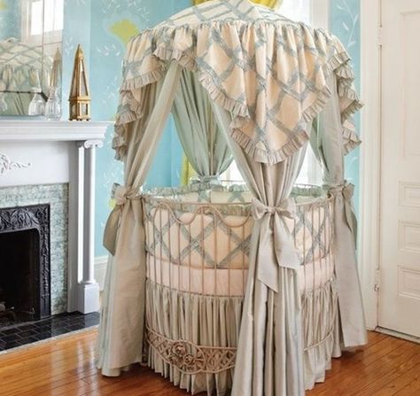 This dramatic round baby crib is a stunning focal point in the living room with a draped canopy and printed fabric Circular Crib, Round Baby Cribs, Round Crib, Baby Crib Designs, Canopy Crib, Round Cribs, Crib Design, Crib Canopy, Cozy Nursery