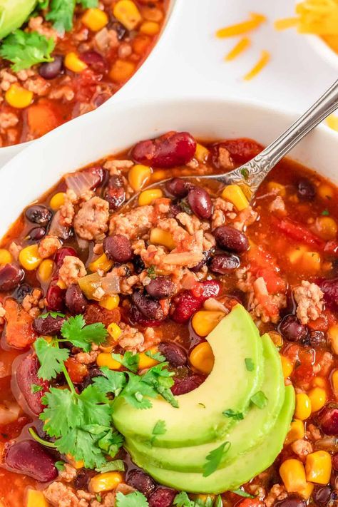 This Easy Taco Soup with Ranch Dressing will be a huge hit with your whole family! Ground beef, tomatoes, taco and ranch seasonings are all simmered to perfection, then served with all of your favorite taco toppings! This easy taco soup recipe can be made on the crockpot or (quickly!) on the stovetop and it's a freezer-friendly soup and perfect for meal preps! This can be a crockpot taco soup or you can make it on the stove. Taco Soup With Ranch Packet, Taco Soup With Ranch, Taco Soup Ranch, Crock Pot Taco Soup, Easy Goulash, Easy Goulash Recipes, Crockpot Recipes Ground Beef, Chicken Breast In Air Fryer, Salads Recipes For Dinner