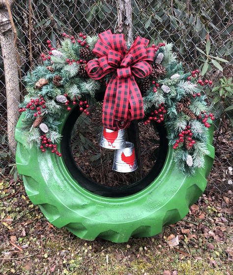 I built this wreath on a used tractor tire. It’s decorated with galvanized buckets/bells with chickens painted on them and two large swags, frosted greenery, pine cones, red berries and large buffalo plaid bow. Natal Country, Christmas Garden Decorations, Outside Christmas Decorations, Tractor Tire, Operation Christmas, Christmas Yard Decorations, Easy Christmas Decorations, Corn Maze, Christmas Decorations Diy Outdoor