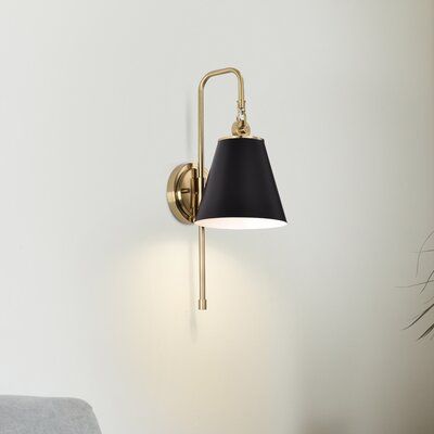 With subtle detailing, the Dover wall sconce is graceful yet unassuming. The simple shade features a trim finish that matches the fixture's body. Place in a dining room for ambiance, or bring added light to a dark hallway or entry. Shade Color: Black/Vintage Brass | Everly Quinn Josiyah 1 - Light Dimmable Armed Sconce Metal in Yellow / Black, Size 19.0 H x 7.0 W x 9.25 D in | Wayfair Hallway Sconces, Black Walls Bedroom, Dark Hallway, Black Sconces, Light Ideas, Crystal Wall Sconces, Wall Lights Bedroom, Bathroom Sconces, Linear Chandelier