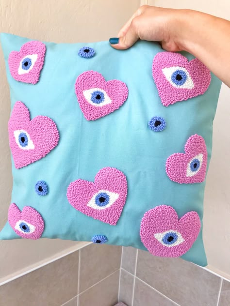 This punch needle evil eye pillow cover is handmade. Embroidery heart pillow case will change the atmosphere of your home. You can complete the decoration of your living room with this mint blue cushion case. You can place the decorative pillow on your sofa or give it to a friend as a housewarming gift. Punch Needle Pillow Case, Punch Needle Pillow Diy, Pillow Case Design Ideas, Evil Eye Embroidery, Punch Needle Cushion, Pillow Cover Ideas, Evil Eye Pillow, Punch Needle Pillow, Needle Pillow